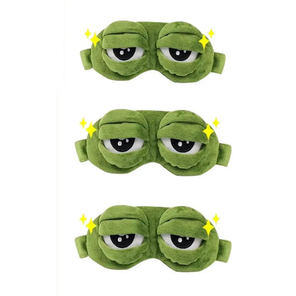 Frog Sleep Mask — a Stylish, Shimmering Sleep Mask Featuring an Adorable "Sad Frog" Design. This Fun, Plush Eye Mask Is Perfect for Travel, Yoga, Napping, and Light-Blocking; Its Soft Cotton Lining Gently Cares for Sensitive Skin.
