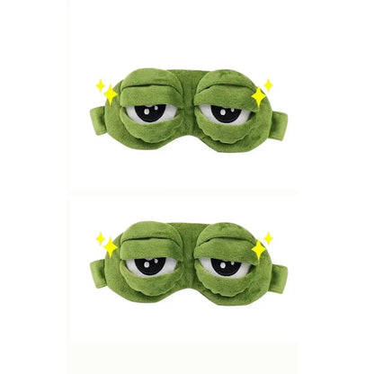 Frog Sleep Mask — a Stylish, Shimmering Sleep Mask Featuring an Adorable "Sad Frog" Design. This Fun, Plush Eye Mask Is Perfect for Travel, Yoga, Napping, and Light-Blocking; Its Soft Cotton Lining Gently Cares for Sensitive Skin.
